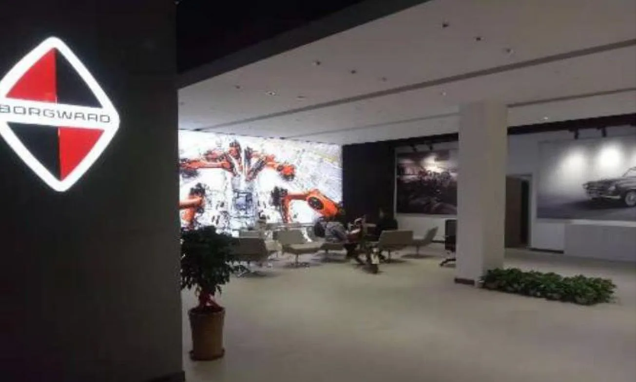 Borgward showroom interior with the illuminated marque and an LED display wall